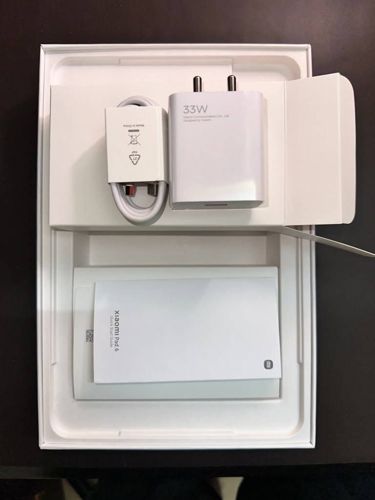 Unboxed contents of Pad 6 with charger and USB-A to USB-C cable