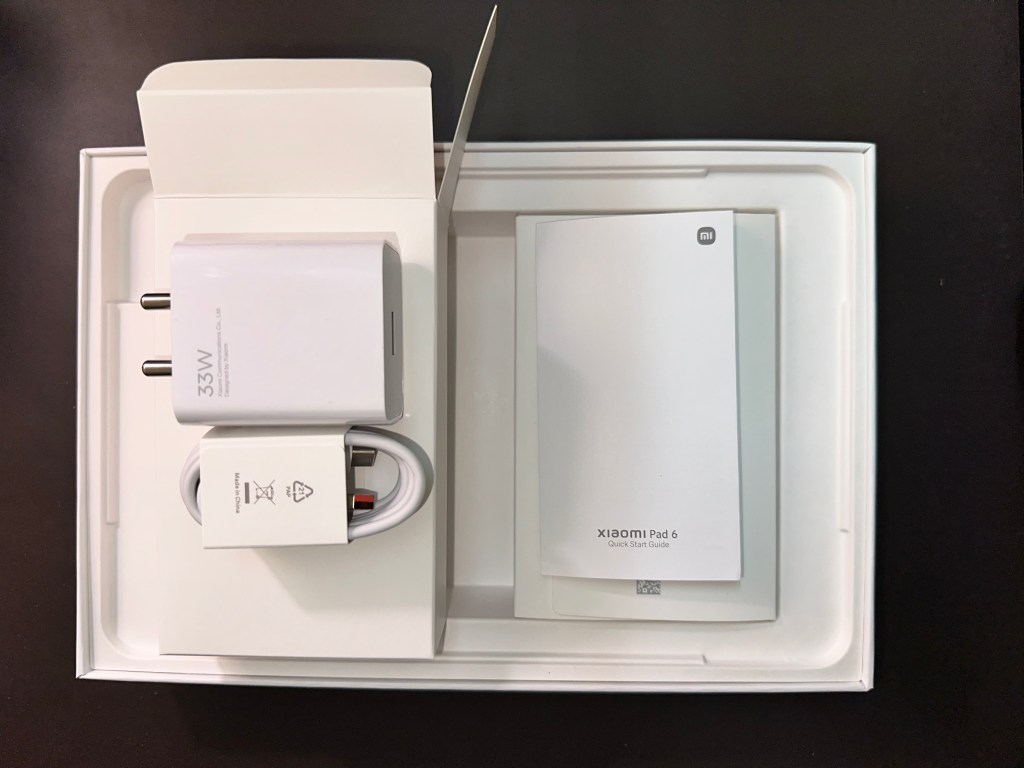 The package contains the Xiaomi Pad 6 tablet, some paperwork, a 33W charger and a USB-A to USB-C cable